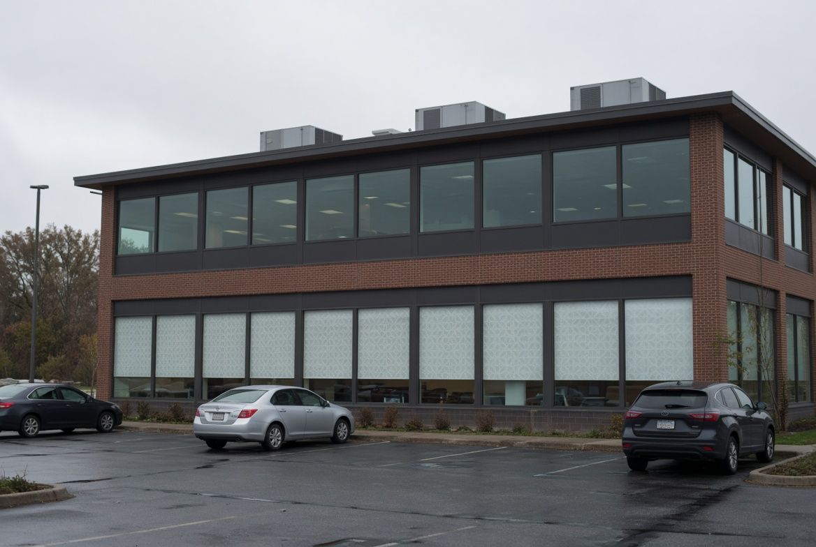 Two-story office building with decorative film on ground-floor windows