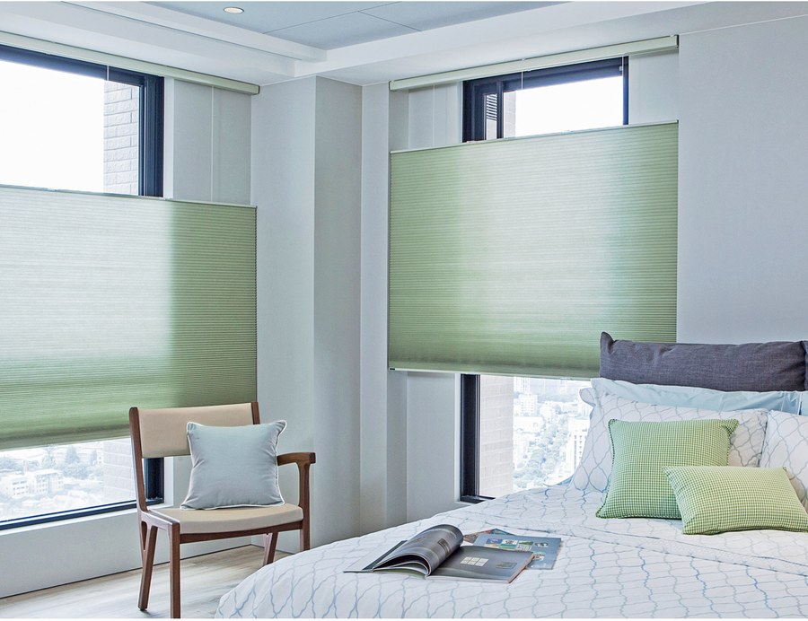Honeycomb cellular shades in a bedroom
