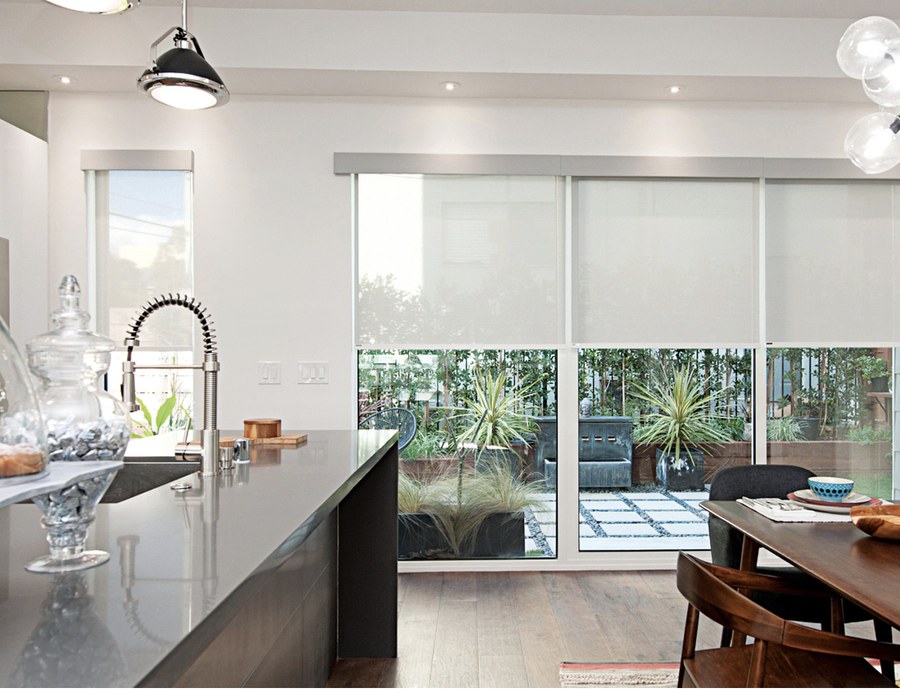 Roller shades over kitchen patio doors